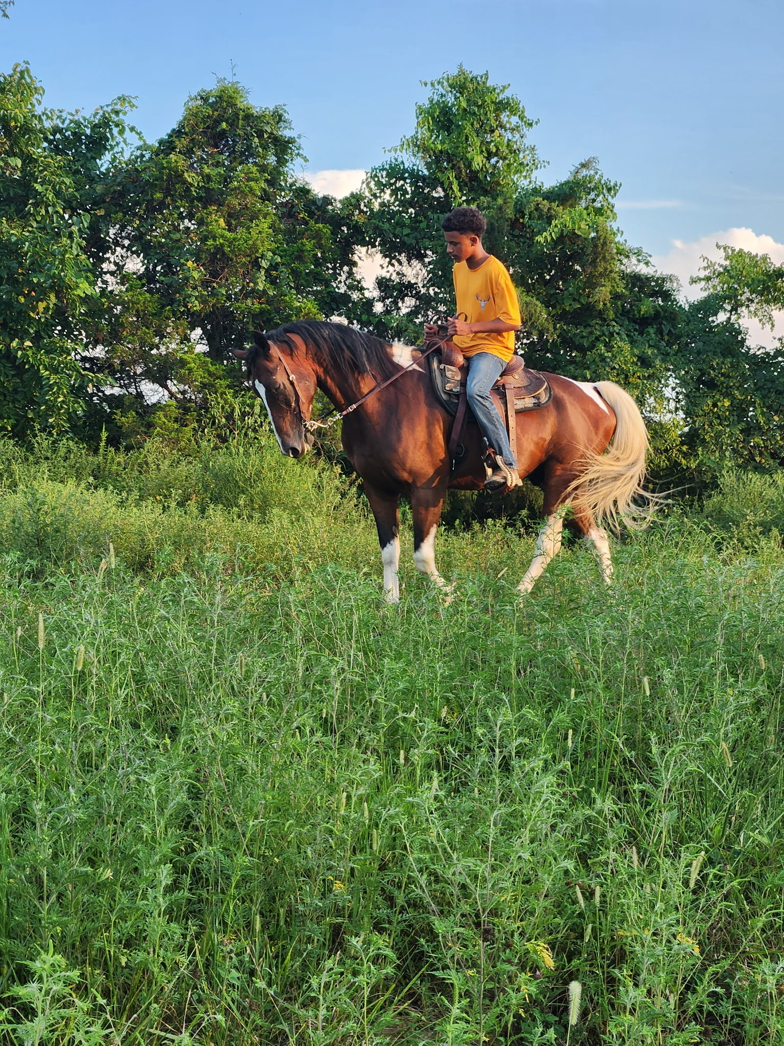 Isaiha riding a horse